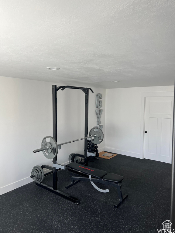 Workout room with a textured ceiling