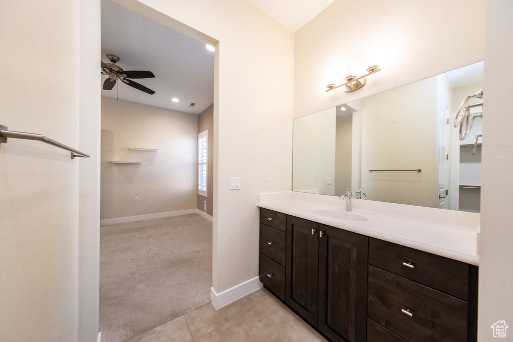 Bathroom with vanity, ceiling fan, and tile floors