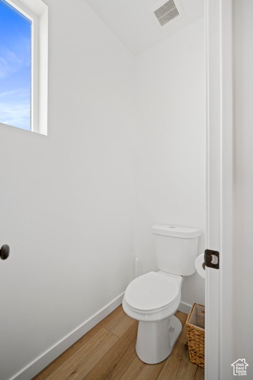 Bathroom featuring toilet and hardwood / wood-style floors