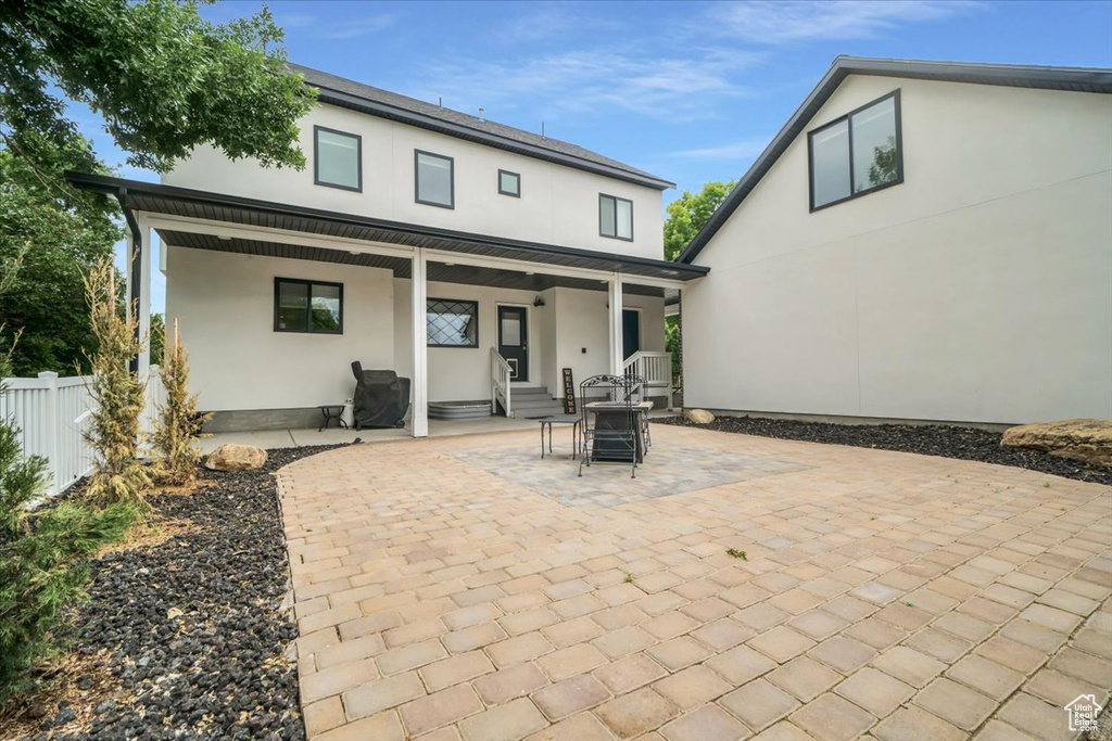 Rear view of property with a patio
