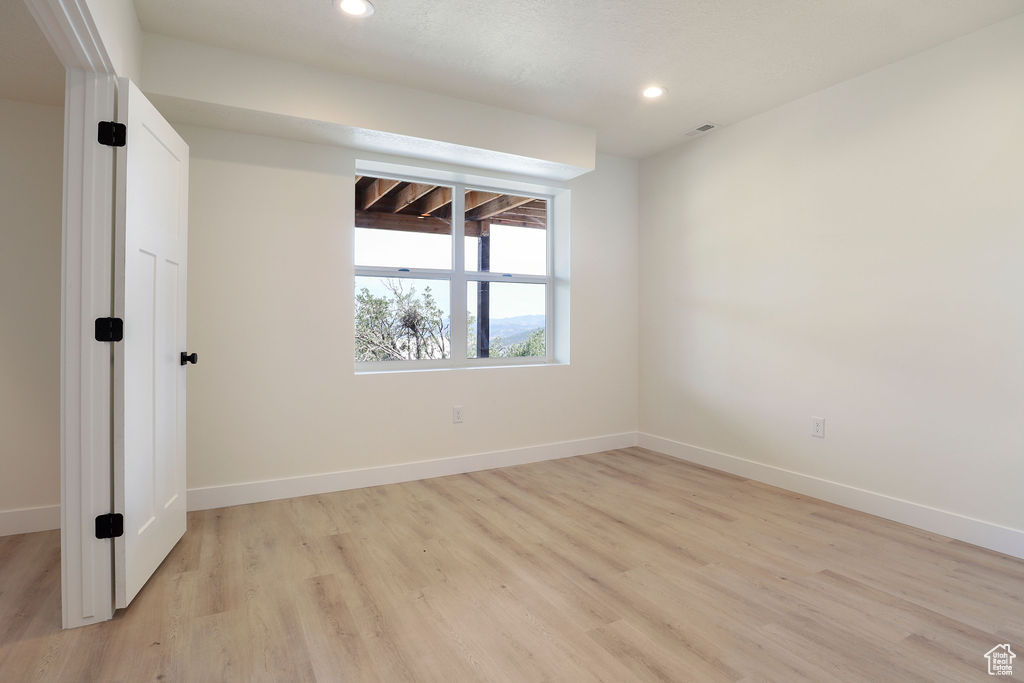 Spare room featuring light hardwood / wood-style floors