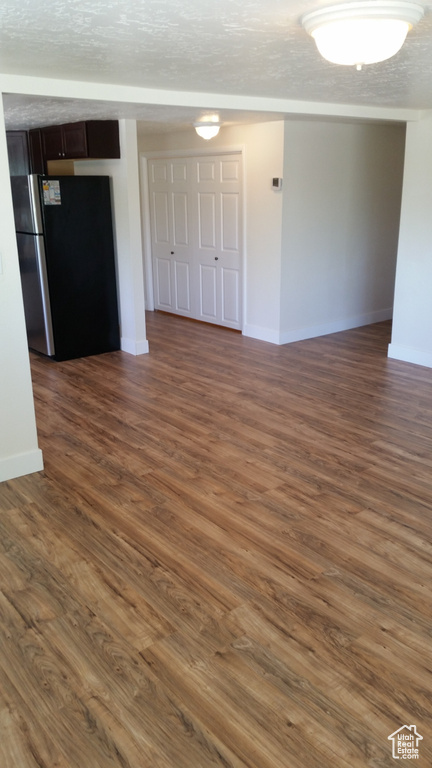 Spare room featuring dark hardwood / wood-style flooring