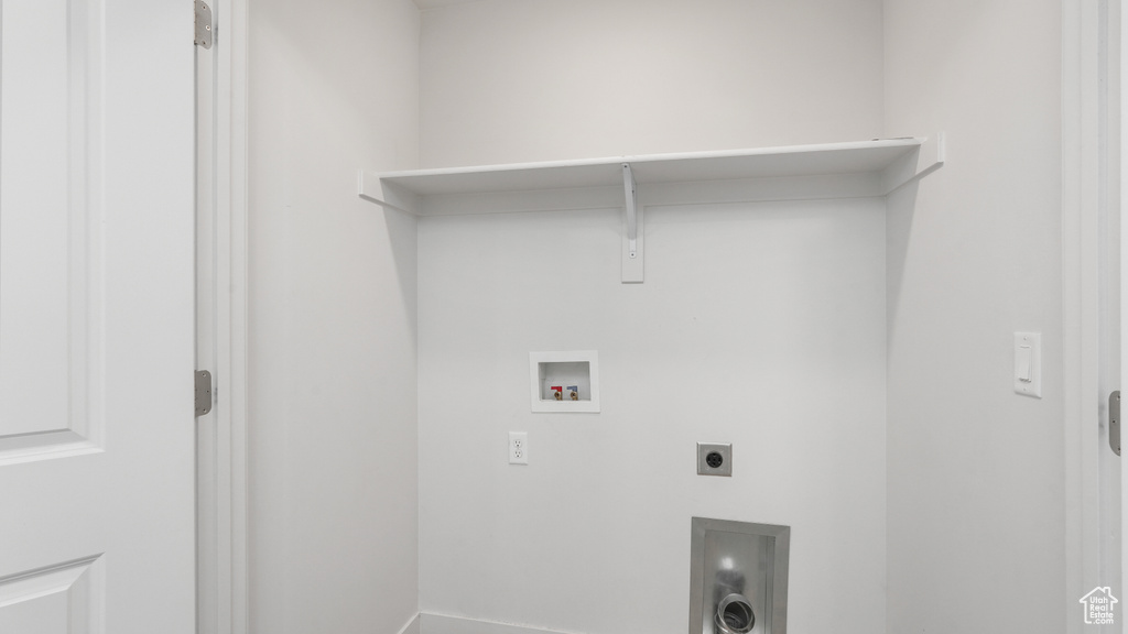 Washroom featuring hookup for an electric dryer and washer hookup