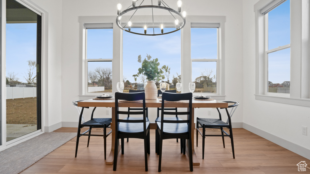 Dining room featuring a chandelier and light hardwood / wood-style floors