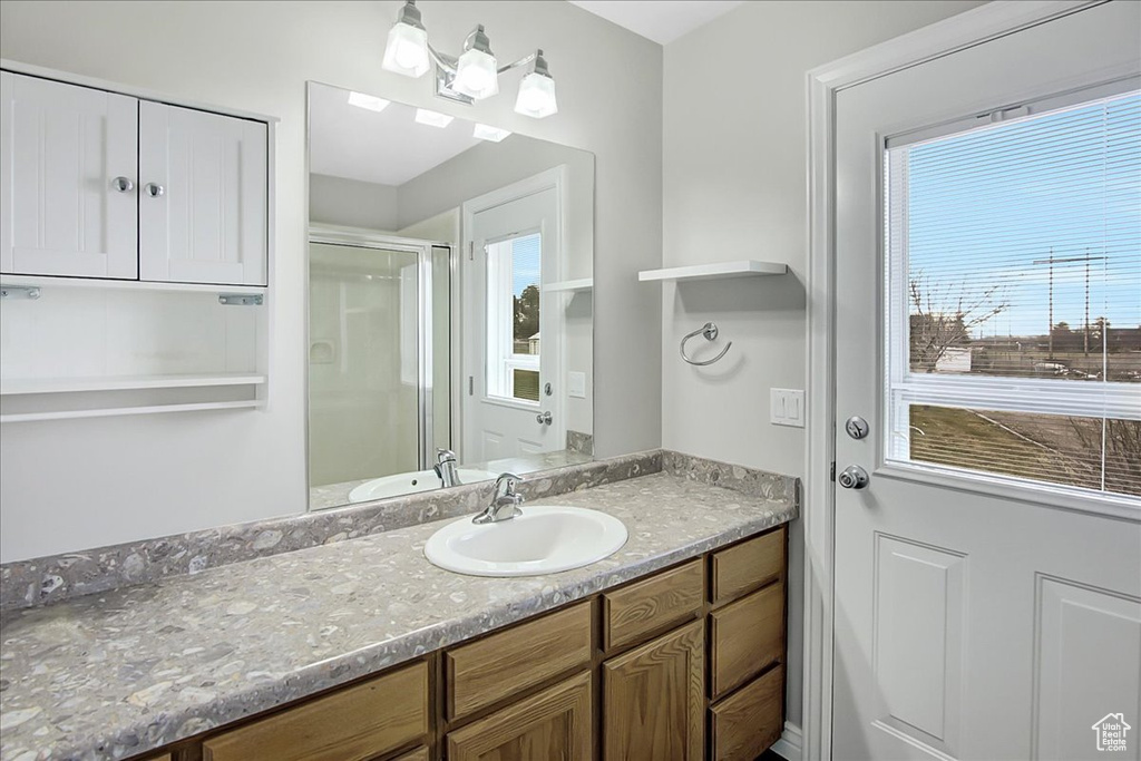Bathroom with large vanity and a healthy amount of sunlight