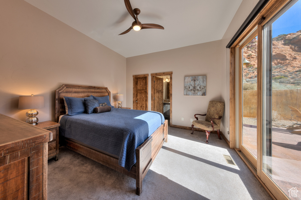 Bedroom with dark colored carpet, access to outside, and ceiling fan
