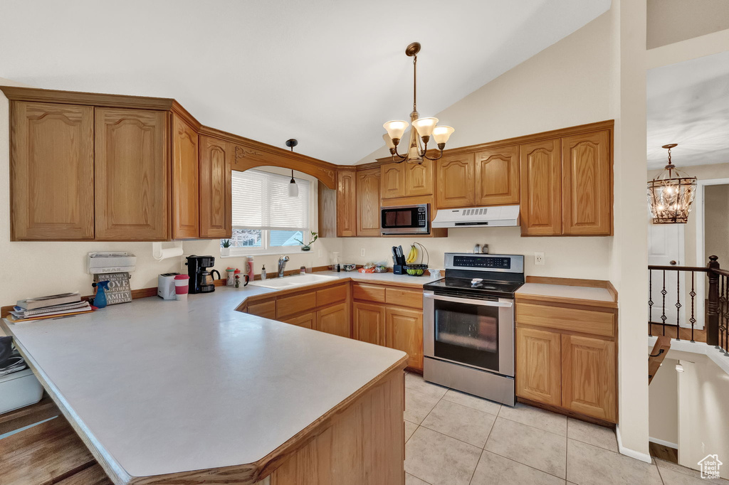 Kitchen with a chandelier, appliances with stainless steel finishes, decorative light fixtures, and sink