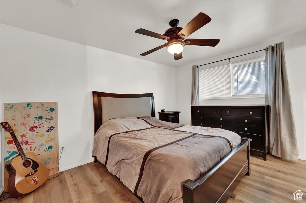 Bedroom with light wood-type flooring and ceiling fan