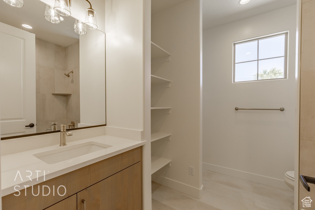 Bathroom with vanity and toilet