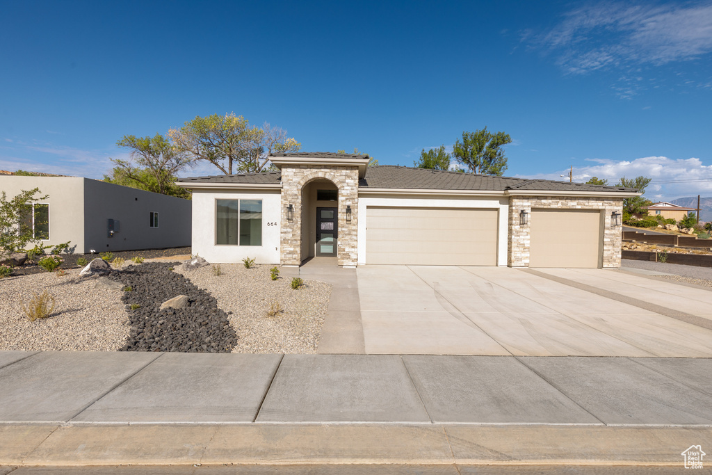 Prairie-style house featuring a garage