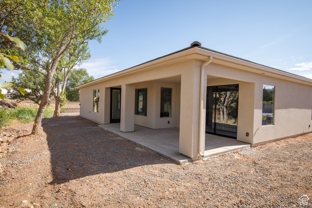 Rear view of property featuring a patio