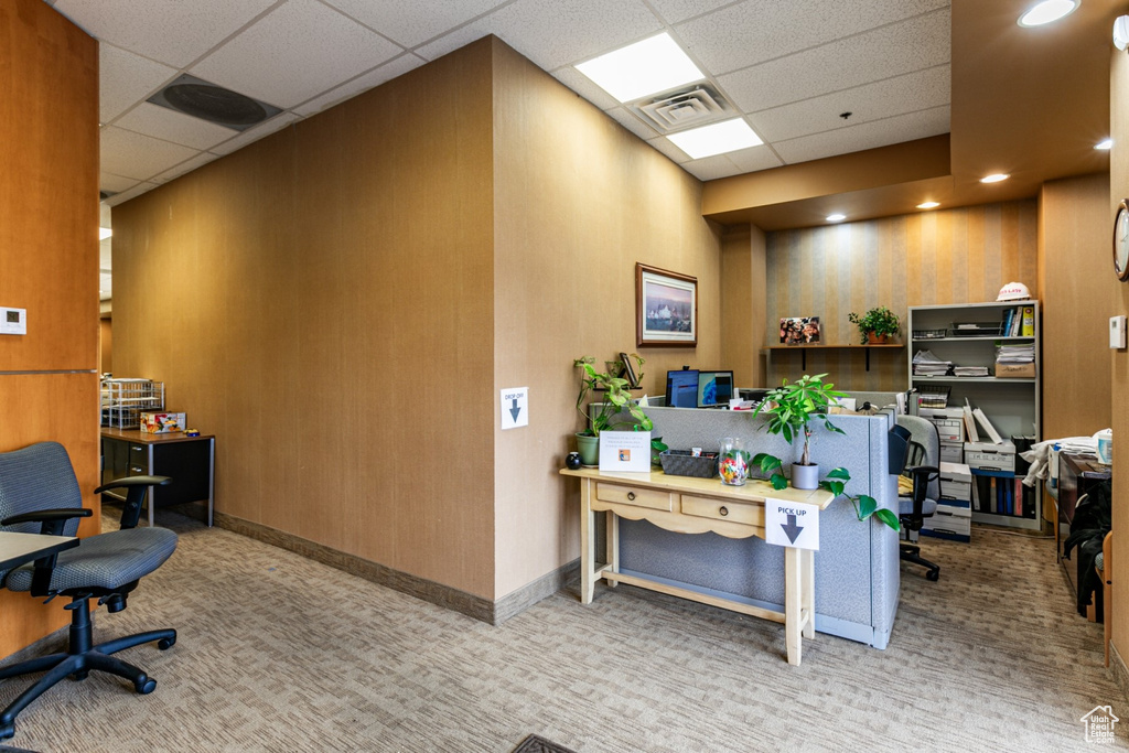 Office featuring light carpet and a paneled ceiling