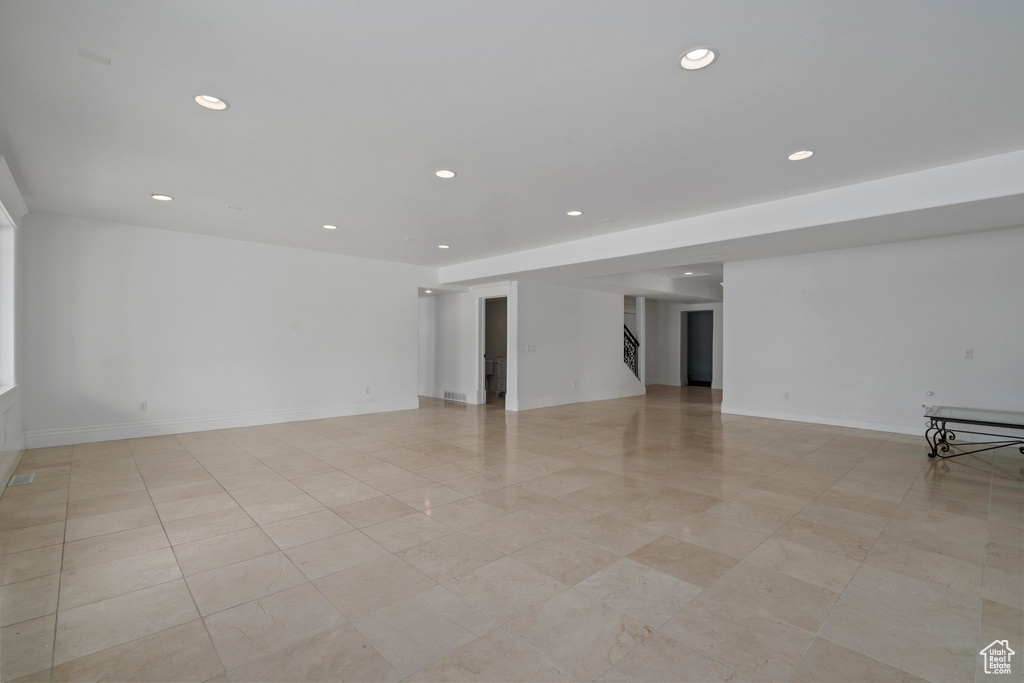 Unfurnished room with light tile floors