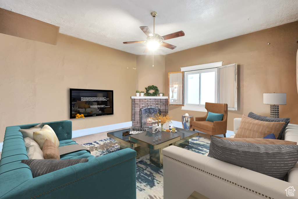 Living room with ceiling fan and a brick fireplace