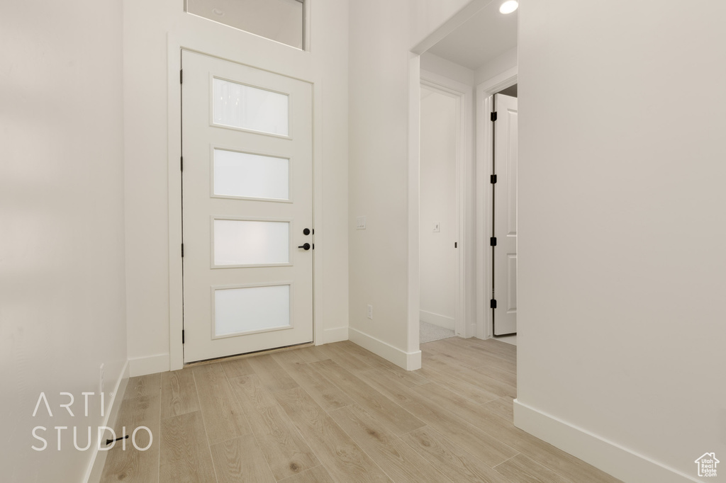 Entryway with light hardwood / wood-style flooring