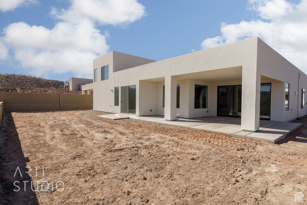 Rear view of house with a patio area