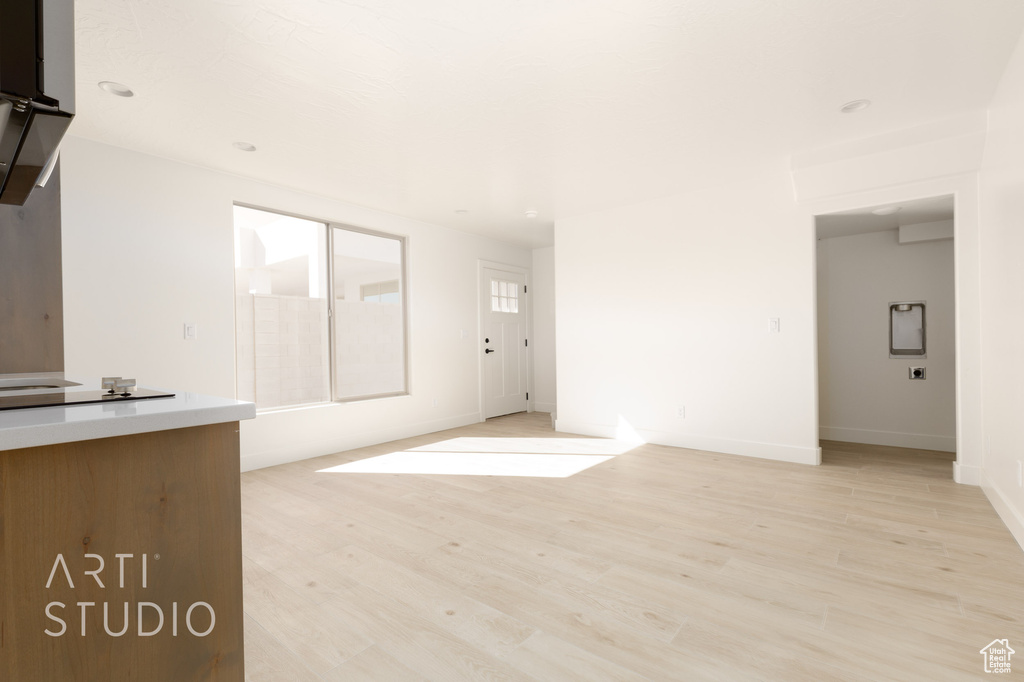 Unfurnished living room with light hardwood / wood-style flooring