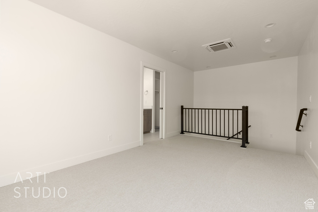 Unfurnished room with carpet