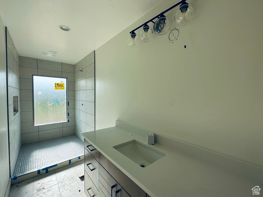 Bathroom with vanity and tile patterned floors