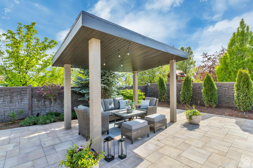 View of patio with an outdoor living space