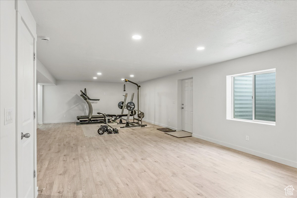 Exercise area with light wood-type flooring