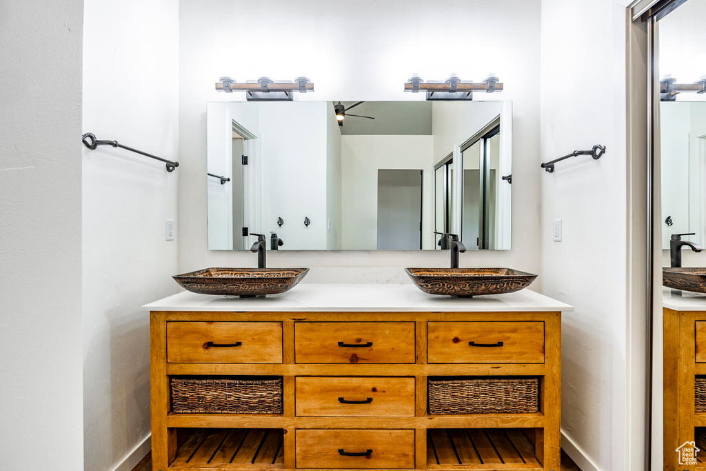 Bathroom featuring large vanity and dual sinks