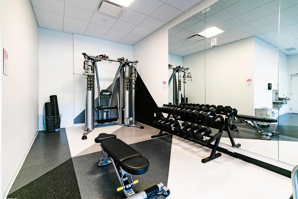 Exercise area featuring a paneled ceiling