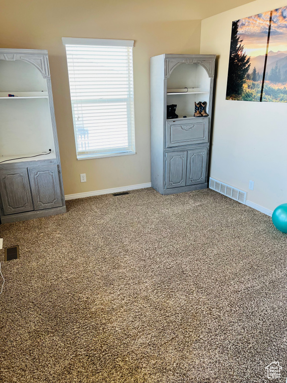 Unfurnished bedroom featuring carpet flooring