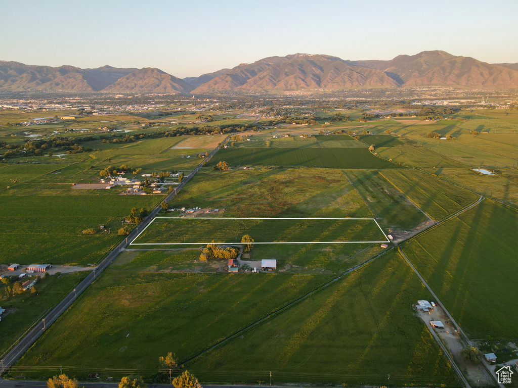 Birds eye view of property with a mountain view and a rural view