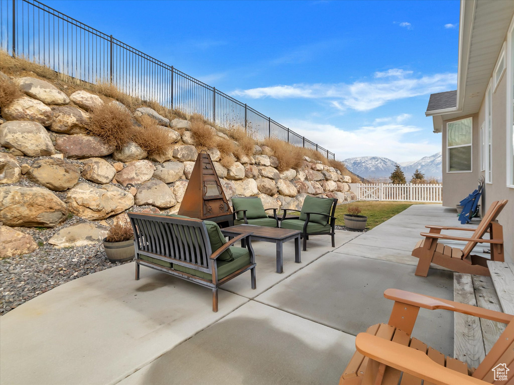 View of patio featuring outdoor lounge area and a mountain view