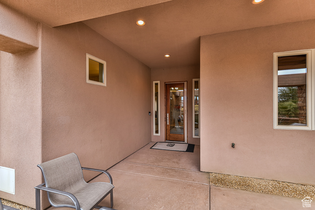 Property entrance featuring a patio area