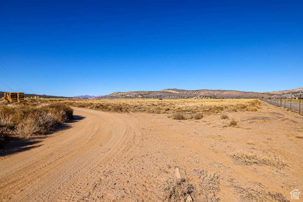 Property view of mountains with a rural view