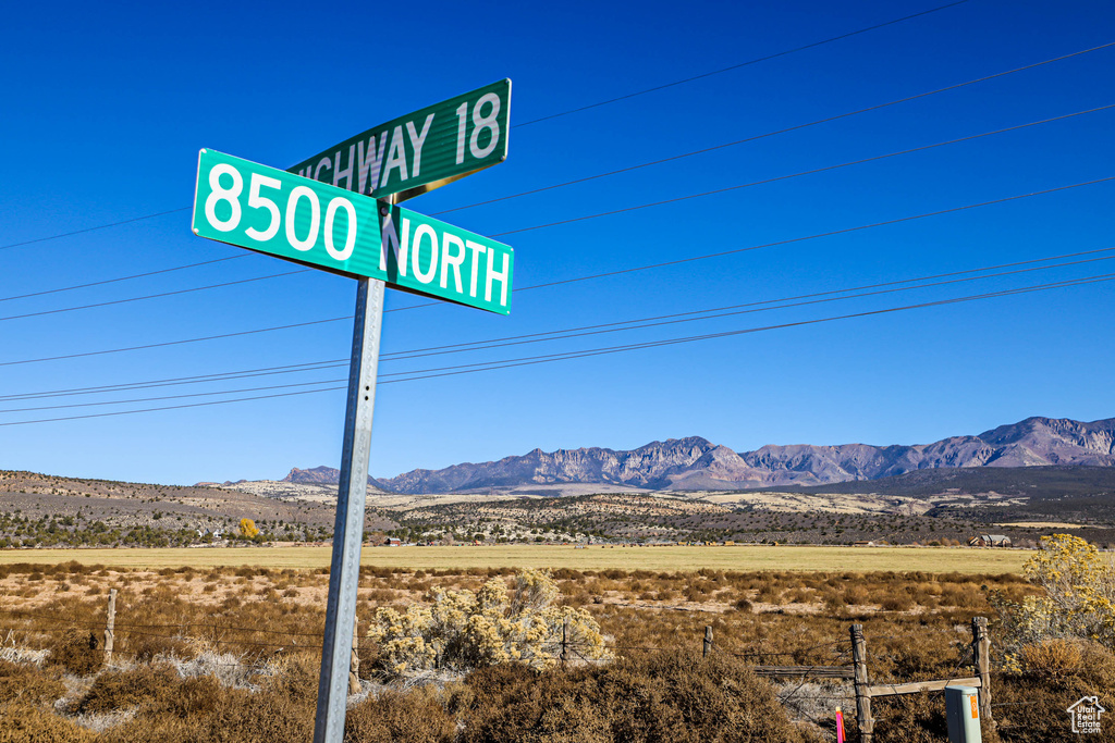 Community / neighborhood sign featuring a mountain view