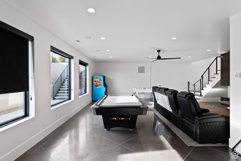 Recreation room featuring ceiling fan, dark tile floors, and pool table