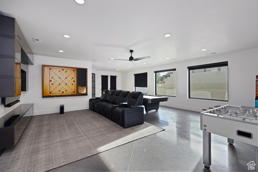 Living room featuring ceiling fan and pool table