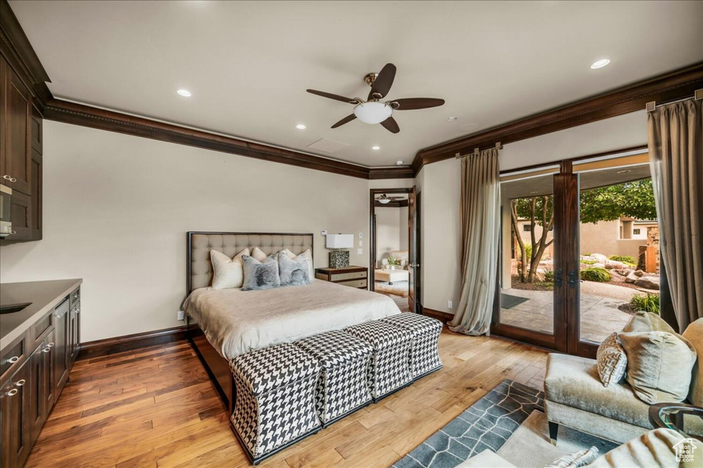 Bedroom with access to outside, crown molding, ceiling fan, and light hardwood / wood-style flooring