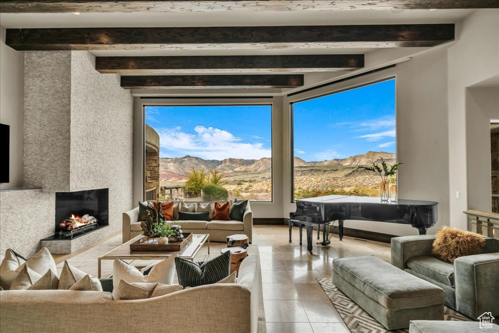 Tiled living room with beamed ceiling and a mountain view