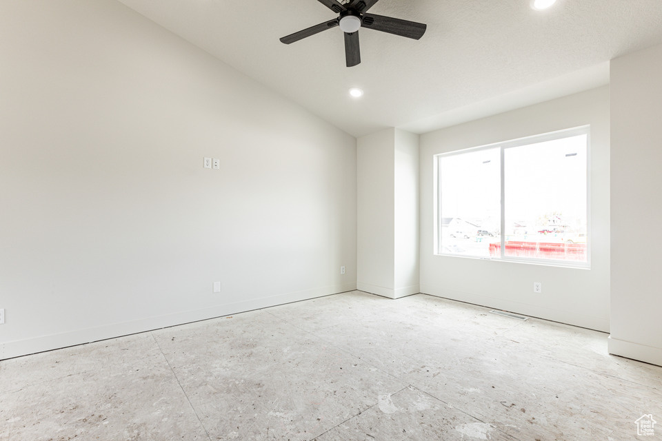 Unfurnished room featuring ceiling fan