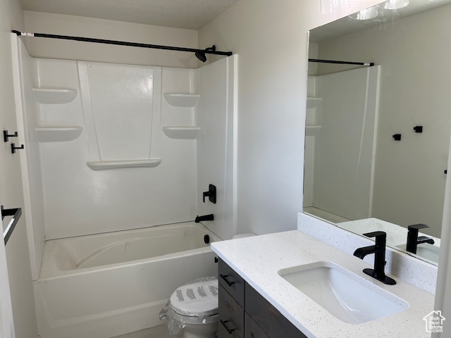 Full bathroom featuring toilet, vanity, and shower / bath combination