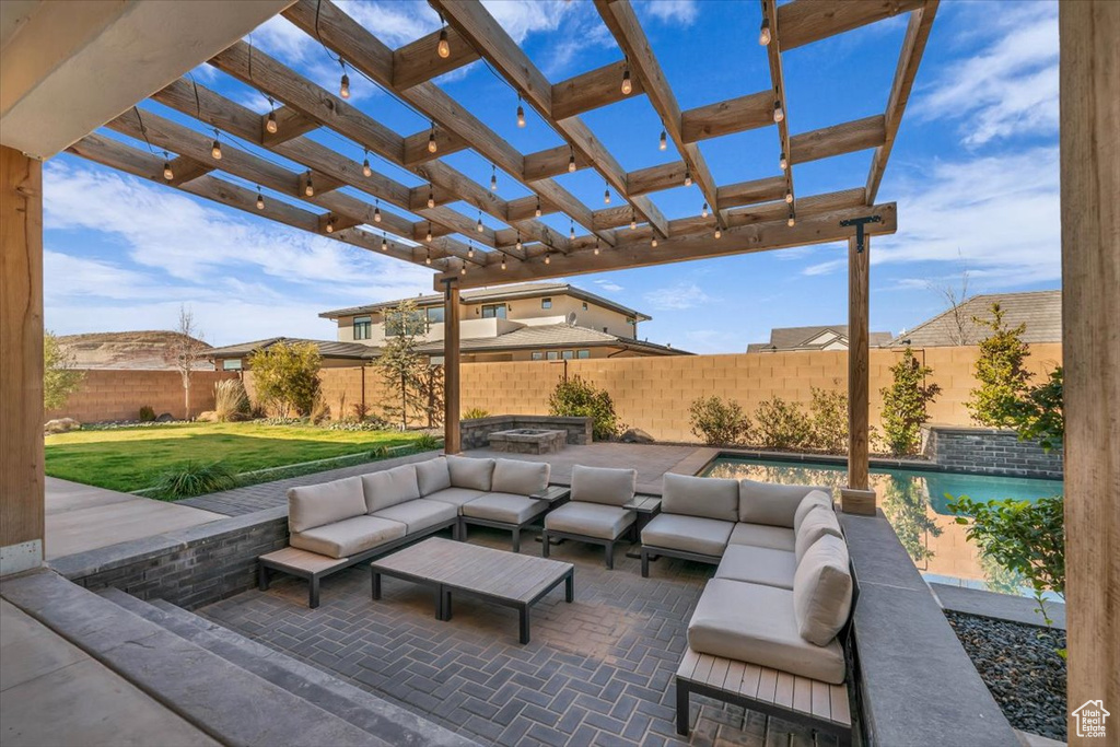 View of patio featuring an outdoor hangout area and a pergola