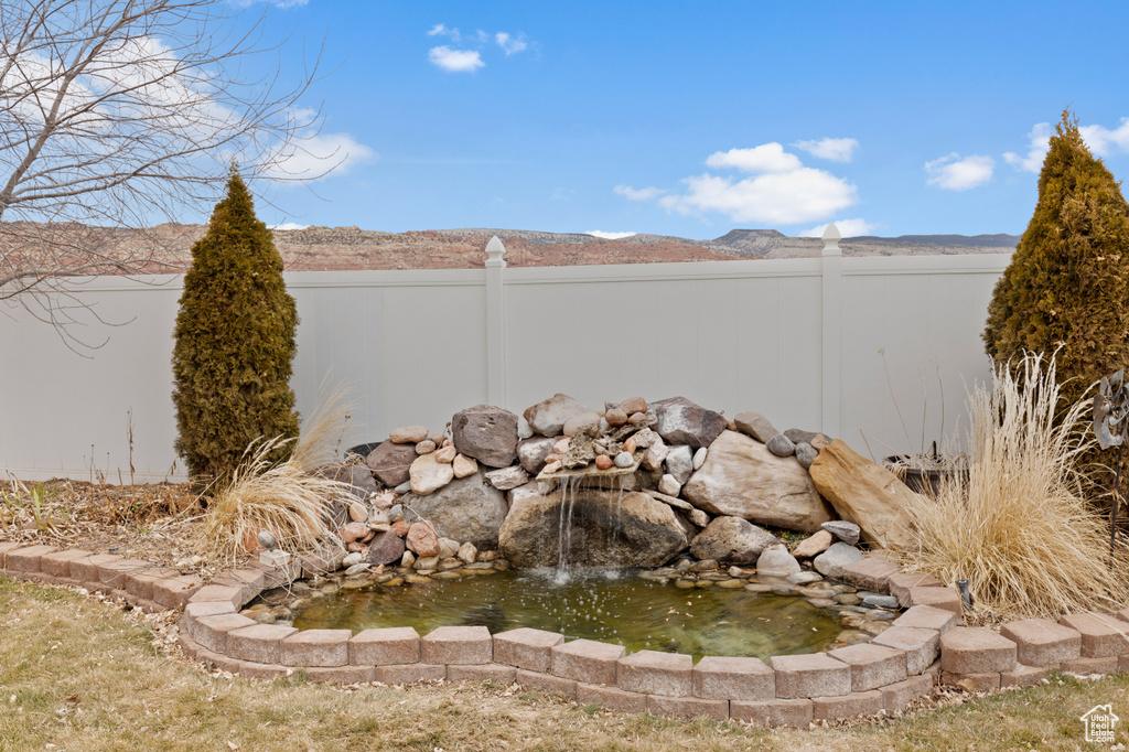 View of water feature with a mountain view