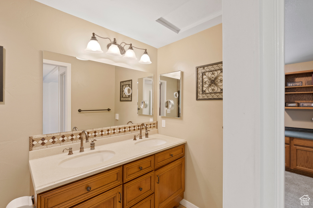 Bathroom featuring dual sinks and large vanity