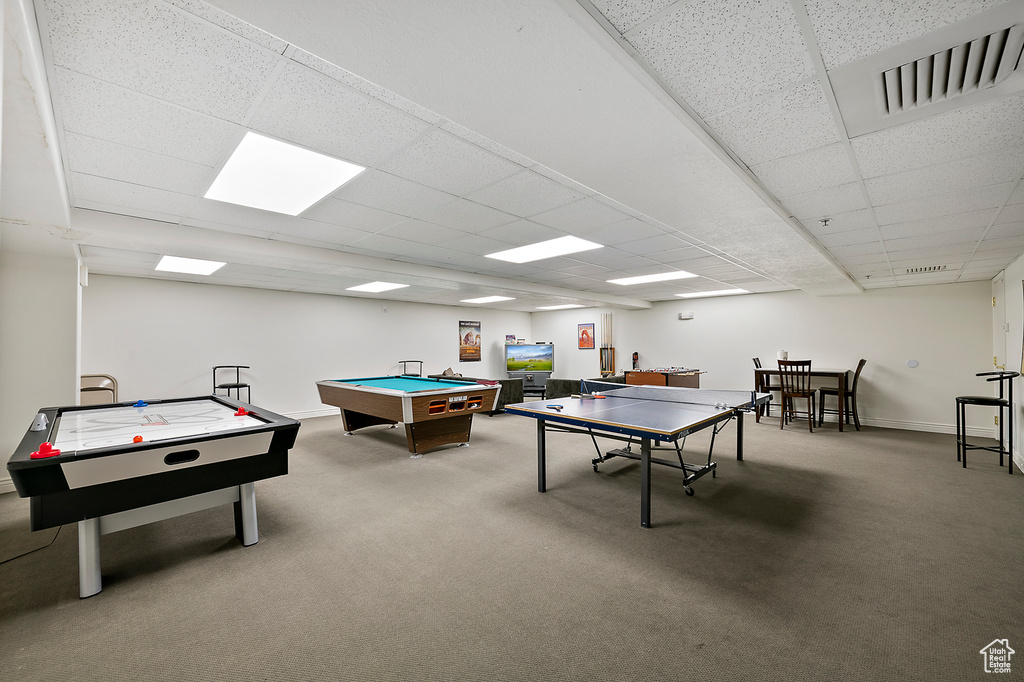 Recreation room featuring billiards, a drop ceiling, and carpet flooring