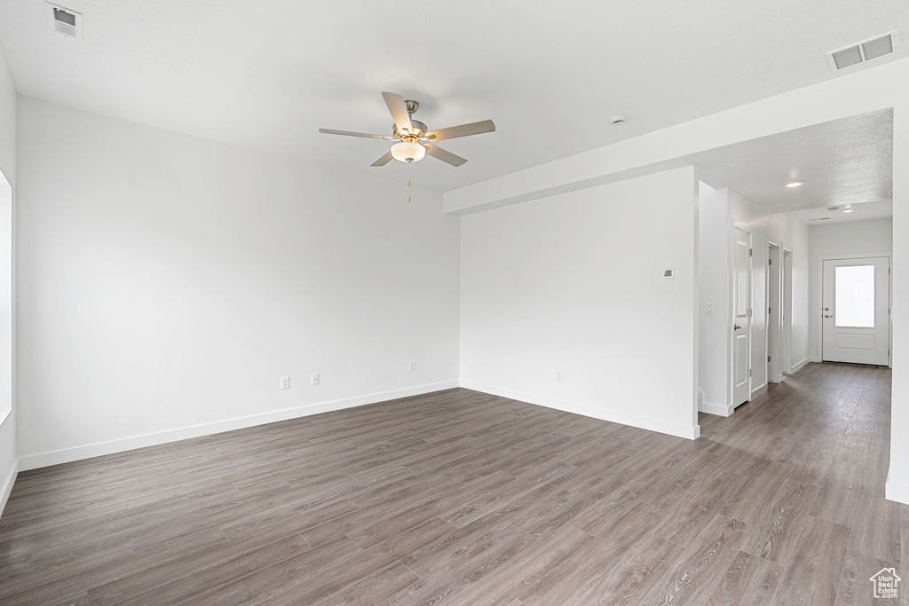 Empty room featuring light hardwood / wood-style floors and ceiling fan