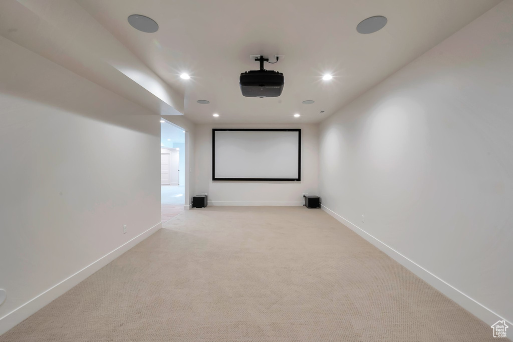 Home theater room with light carpet