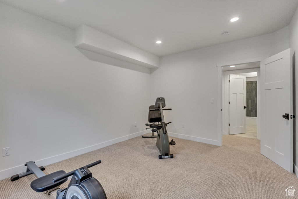 Exercise room with light carpet