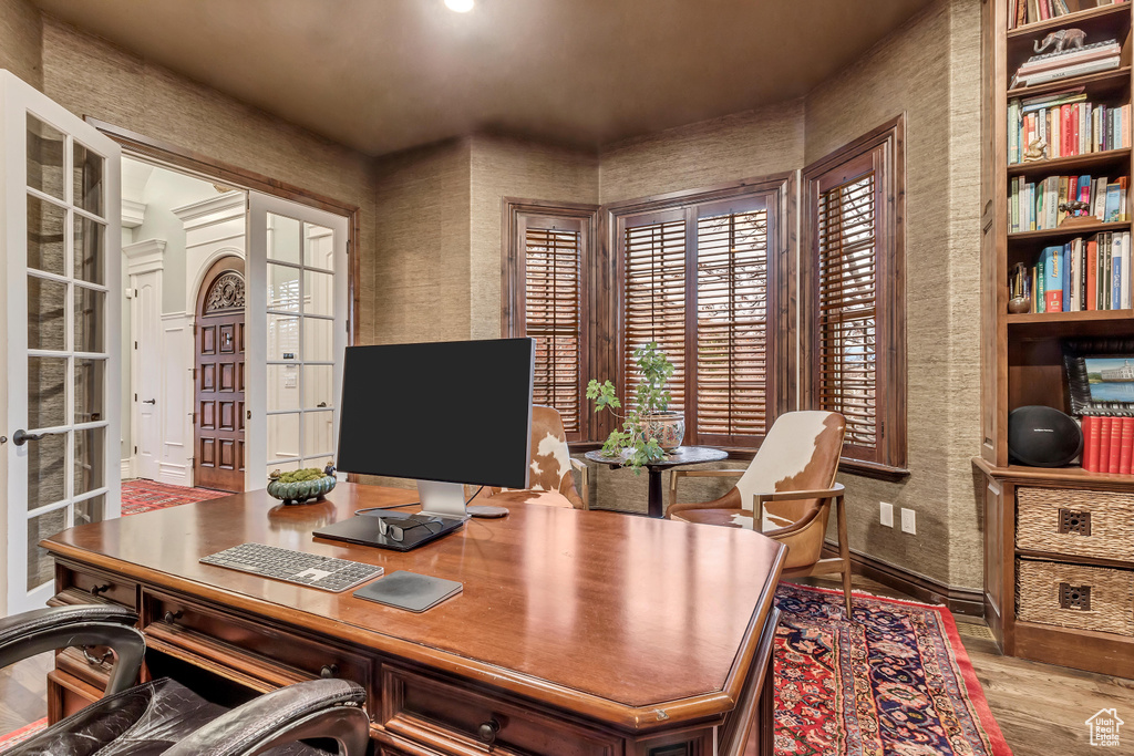 Office area featuring hardwood / wood-style floors and french doors