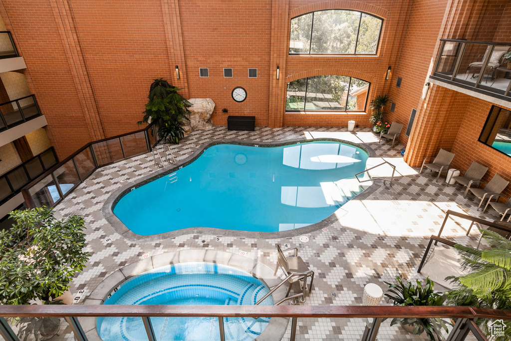 View of pool featuring an indoor in ground hot tub
