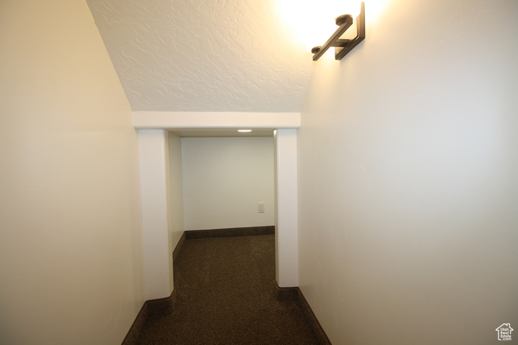 Hall with dark colored carpet