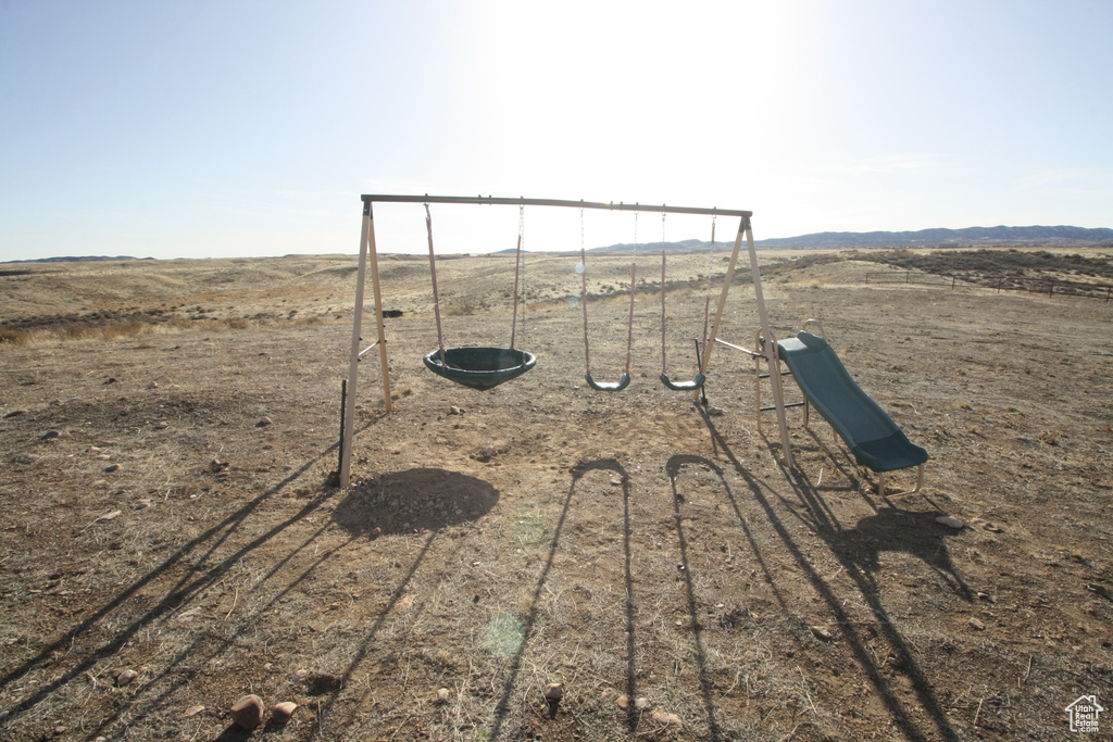 View of playground with a rural view